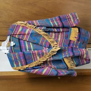 Multi-colored blazer with faux suede fringed collar and pockets.